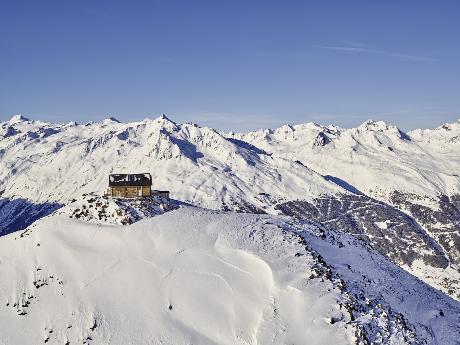 Aerial view in the Sölden ski area — mountain hut high above the winter pistes