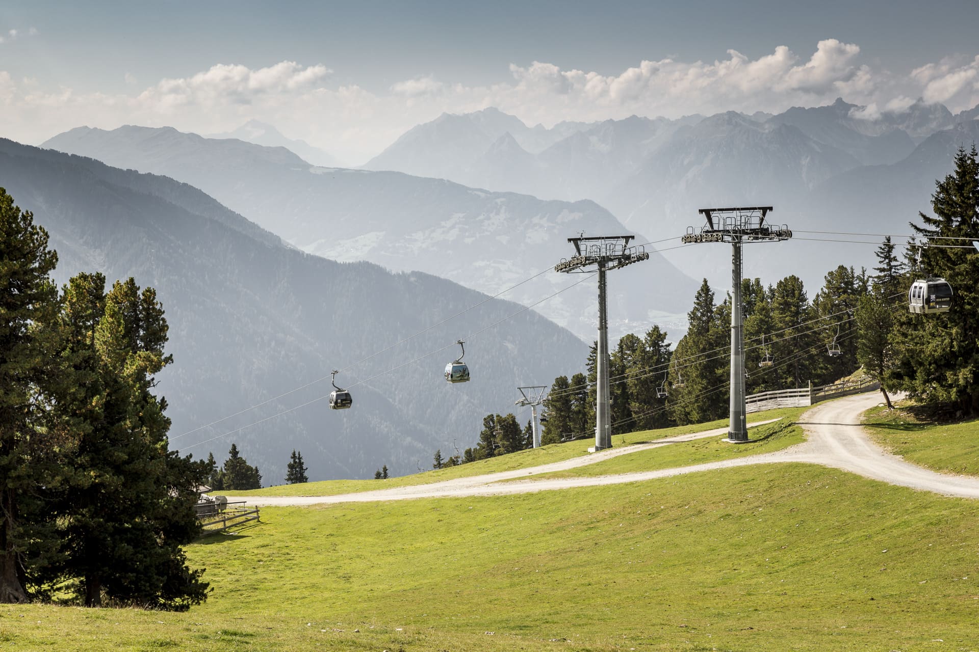 Hiker with gondola lift in summer near Oetz