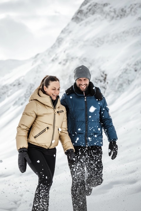 Couple winter hiking in the snowy Ötztal Valley